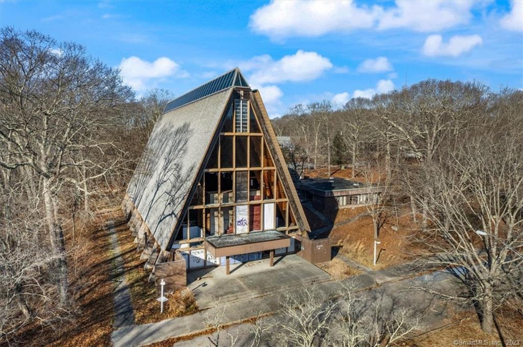 The A-frame chapel seen from the entrance drive
